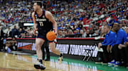 Mar 23, 2025; Raleigh, NC, USA; Connecticut Huskies forward Alex Karaban (11) drives to the basket during the first half against the Florida Gators in the second round of the NCAA Tournament at Lenovo Center. Mandatory Credit: Bob Donnan-Imagn Images
