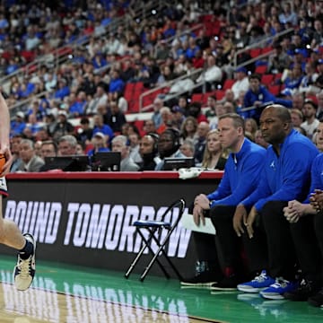 Mar 23, 2025; Raleigh, NC, USA; Connecticut Huskies forward Alex Karaban (11) drives to the basket during the first half against the Florida Gators in the second round of the NCAA Tournament at Lenovo Center. Mandatory Credit: Bob Donnan-Imagn Images