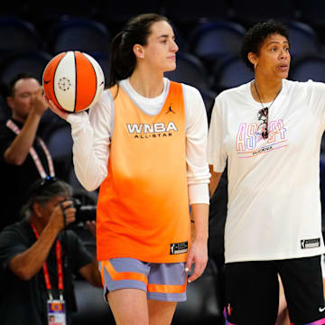 Team WNBA All-Star coach Cheryl Miller talks to Indiana Fever guard Caitlin Clark 