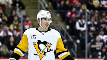 Apr 11, 2025; Newark, New Jersey, USA; Pittsburgh Penguins center Connor Dewar (19) during the second period against the New Jersey Devils at Prudential Center. Mandatory Credit: John Jones-Imagn Images