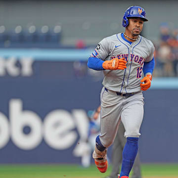 Sep 11, 2024; Toronto, Ontario, CAN; New York Mets shortstop Francisco Lindor (12) runs the bases after hitting a home run against the Toronto Blue Jays during the ninth inning at Rogers Centre.