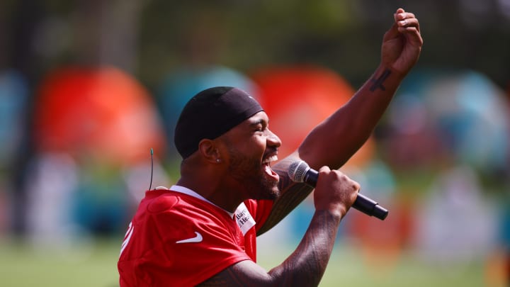 Jul 28, 2024; Miami Gardens, FL, USA; Miami Dolphins quarterback Tua Tagovailoa (1) talks to fans during training camp at Baptist Health Training Complex.