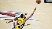 Jun 5, 2025; Oklahoma City, Oklahoma, USA; Indiana Pacers guard Tyrese Haliburton (0) shoots the ball against Oklahoma City Thunder guard Shai Gilgeous-Alexander (2) during the fourth quarter in game one of the 2025 NBA Finals at Paycom Center. Mandatory Credit: Kyle Terada-Imagn Images