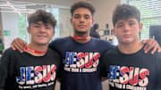 Jayden O'Farrill (right) with Bishop McCort teammates and Junior Fargo Champs, Bo Bassett (left) and Melvin Miller (center).