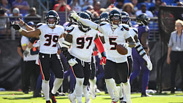 Jalen Pitre and the Houston Texans defense celebrates following a turnover in their 44-10 win over the Baltimore Ravens 