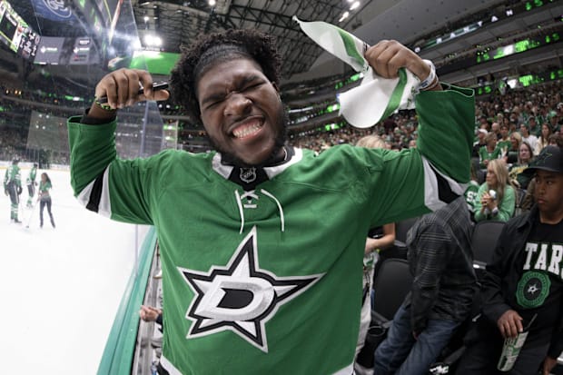 Dallas Cowboys 2025 first-round pick Tyler Booker poses for a photo during the game between the Dallas Stars and Winnipeg.