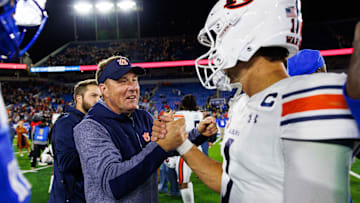 Oct 26, 2024; Lexington, Kentucky, USA; Auburn Tigers head coach Hugh Freeze celebrates with quarterback Payton Thorne (1) after the game at Kroger Field. Mandatory Credit: Jordan Prather-Imagn Images