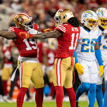 November 13, 2022; Santa Clara, California, USA; San Francisco 49ers wide receiver Deebo Samuel (19) and wide receiver Brandon Aiyuk (11) celebrate a first down against the Los Angeles Chargers during the first quarter at Levi's Stadium. Mandatory Credit: Kyle Terada-Imagn Images