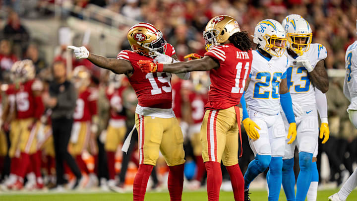 November 13, 2022; Santa Clara, California, USA; San Francisco 49ers wide receiver Deebo Samuel (19) and wide receiver Brandon Aiyuk (11) celebrate a first down against the Los Angeles Chargers during the first quarter at Levi's Stadium. Mandatory Credit: Kyle Terada-Imagn Images