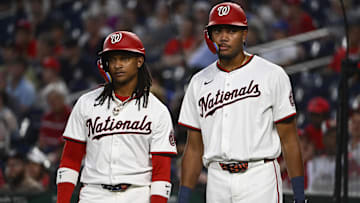 Jun 18, 2025; Washington, District of Columbia, USA; Washington Nationals shortstop CJ Abrams (left) and left fielder James Wood talk during the first inning against the Colorado Rockies at Nationals Park.