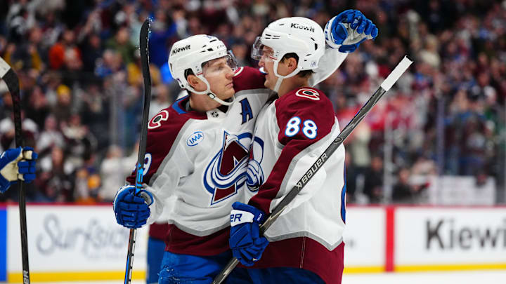 Dec 29, 2025; Denver, Colorado, USA; Colorado Avalanche center Martin Necas (88) (center) celebrates his goal scored with center Nathan MacKinnon (29) n the second period against the Los Angeles Kings at Ball Arena. Mandatory Credit: Ron Chenoy-Imagn Images