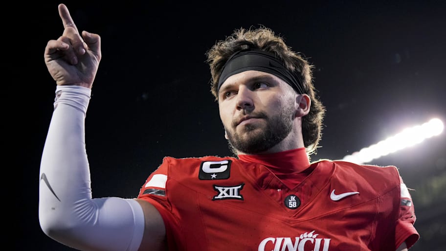 Cincinnati Bearcats quarterback Brendan Sorsby points to fans as he walks off the field