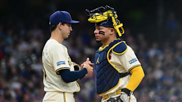 May 27, 2024; Milwaukee, Wisconsin, USA; Milwaukee Brewers catcher William Contreras (24) talks to starting pitcher Robert Gasser (54) during a mound visit in the sixth inning against the Chicago Cubs at American Family Field. Mandatory Credit: Benny Sieu-Imagn Images
