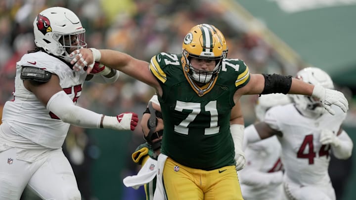 Green Bay Packers center Josh Myers (71) blocks Arizona Cardinals defensive tackle Dante Stills (55) during the quarter of their game Sunday, October 13, 2024 at Lambeau Field in Green Bay, Wisconsin. The Green Bay Packers beat the Arizona Cardinals 34-13.