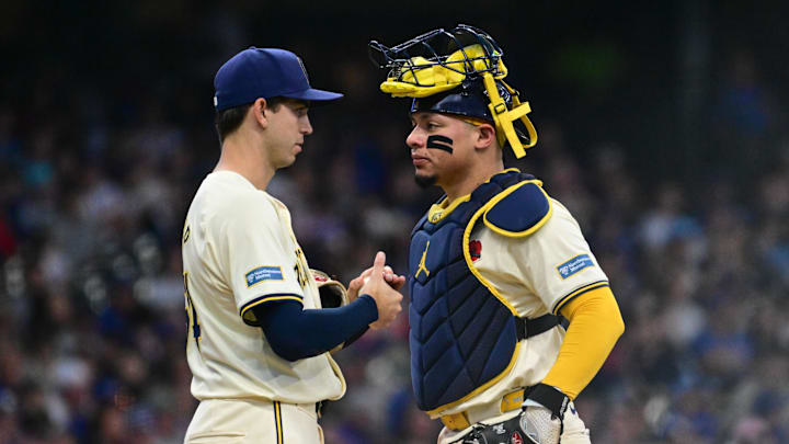 May 27, 2024; Milwaukee, Wisconsin, USA; Milwaukee Brewers catcher William Contreras (24) talks to starting pitcher Robert Gasser (54) during a mound visit in the sixth inning against the Chicago Cubs at American Family Field. Mandatory Credit: Benny Sieu-Imagn Images