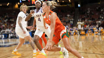 Miami Hurricanes guard Hanna Cavinder drives to the basket against LSU's Flau'jae Johnson in the NCAA women's tournament. 