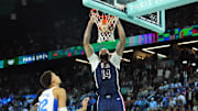 Aug 10, 2024; Paris, France; United States centre Anthony Davis (14) shoots against France power forward Victor Wembanyama (32) in the second half in the men's basketball gold medal game during the Paris 2024 Olympic Summer Games at Accor Arena.