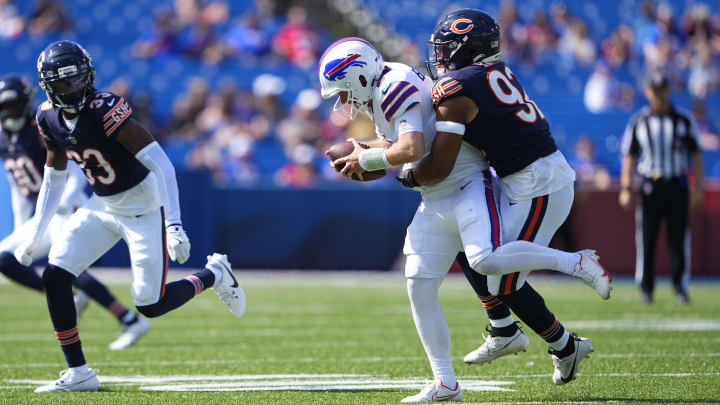 Daniel Hardy makes one of his 2 1/2 sacks against Buffalo. A roster run by the former Rams player wasn't entirely expected.