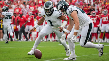  Philadelphia Eagles quarterback Jalen Hurts (1) and tight end Grant Calcaterra (81) go after a fumbled ball during the first quarter of the game against the Kansas City Chiefs at GEHA Field at Arrowhead Stadium.