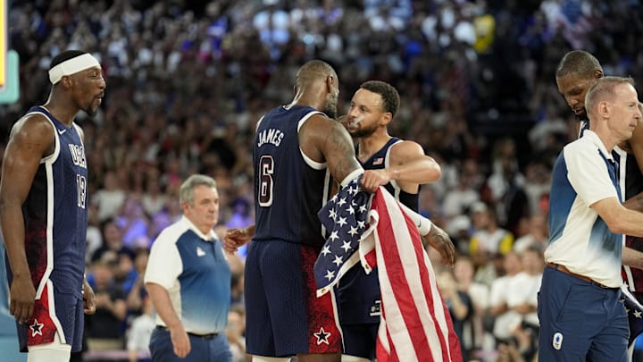 Aug 10, 2024; Paris, France; United States shooting guard Stephen Curry (4) and guard LeBron James (6) celebrate after defeating France in the men's basketball gold medal game during the Paris 2024 Olympic Summer Games at Accor Arena. Mandatory Credit: Kyle Terada-Imagn Images