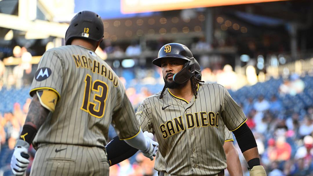 San Diego Padres second baseman Fernando Tatis Jr. is congratulated by third baseman Manny Machado.