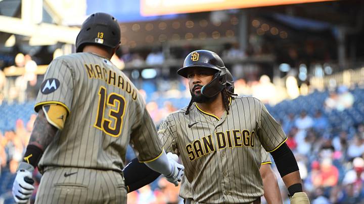 San Diego Padres second baseman Fernando Tatis Jr. is congratulated by third baseman Manny Machado.