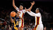 Watkins (center) and the Trojans held UNC-Greensboro to just 25 points on Saturday.
