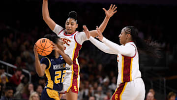 Watkins (center) and the Trojans held UNC-Greensboro to just 25 points on Saturday.