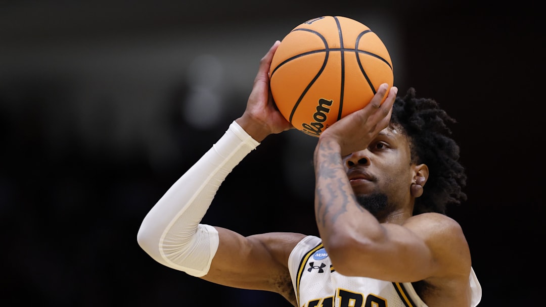 Mar 17, 2026; Dayton, OH, USA; UMBC Retrievers forward DJ Armstrong (3) shoots the ball in the first half against the Howard Bison during a first four game of the men's 2026 NCAA Tournament at University of Dayton Arena.