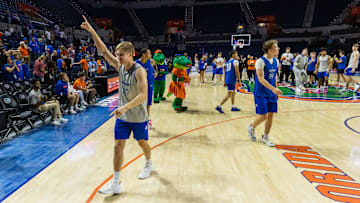 Florida Gators guard Bennett Andersen (22) waves to fans as the team exits. The Florida men   s basketball team held their Orange & Blue Scrimmage at Exactech Arena at the Stephen C. O   Connell Center in Gainesville, FL on Thursday, November 2, 2023. [Doug Engle/Ocala Star Banner]