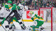 Mar 17, 2025; Saint Paul, Minnesota, USA;  Los Angeles Kings right wing Alex Laferriere (14) shoots against the Minnesota Wild goaltender Filip Gustavsson (32) in the first period at Xcel Energy Center. Mandatory Credit: Brad Rempel-Imagn Images