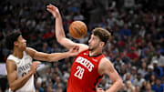 Feb 8, 2025; Dallas, Texas, USA; Dallas Mavericks guard Max Christie (00) and Houston Rockets center Alperen Sengun (28) in action during the game between the Dallas Mavericks and the Houston Rockets at the American Airlines Center. Mandatory Credit: Jerome Miron-Imagn Images