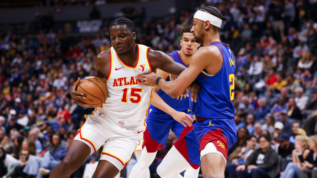 Apr 6, 2024; Denver, Colorado, USA; Atlanta Hawks center Clint Capela (15) drives to the basket while guarded by Denver Nuggets forward Zeke Nnaji (22) in the second half at Ball Arena. Mandatory Credit: Michael Ciaglo-USA TODAY Sports