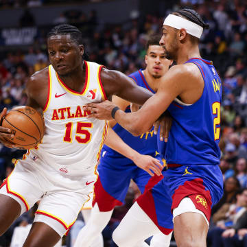 Apr 6, 2024; Denver, Colorado, USA; Atlanta Hawks center Clint Capela (15) drives to the basket while guarded by Denver Nuggets forward Zeke Nnaji (22) in the second half at Ball Arena. Mandatory Credit: Michael Ciaglo-USA TODAY Sports