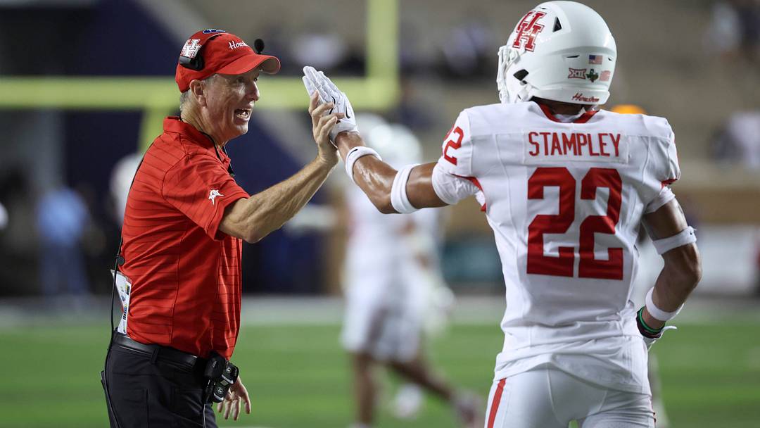 Sep 6, 2025; Houston, Texas, USA; Houston Cougars head coach Willie Fritz celebrates with defensive back Marc Stampley II (22) after a play during the fourth quarter against the Rice Owls at Rice Stadium. Mandatory Credit: Troy Taormina-Imagn Images