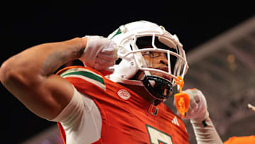 Sep 6, 2025; Miami Gardens, Florida, USA; Miami Hurricanes wide receiver CJ Daniels (7) celebrates after scoring a touchdown against the Bethune-Cookman Wildcats during the second quarter at Hard Rock Stadium. Mandatory Credit: Sam Navarro-Imagn Images