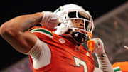 Sep 6, 2025; Miami Gardens, Florida, USA; Miami Hurricanes wide receiver CJ Daniels (7) celebrates after scoring a touchdown against the Bethune-Cookman Wildcats during the second quarter at Hard Rock Stadium. Mandatory Credit: Sam Navarro-Imagn Images