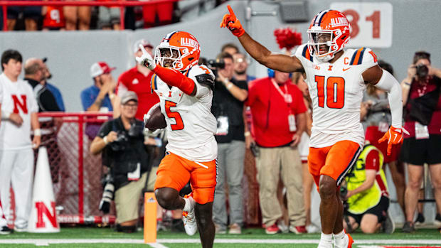 Illinois Fighting Illini defensive back Torrie Cox Jr. (5) and defensive back Miles Scott (10) celebrate after an interceptio