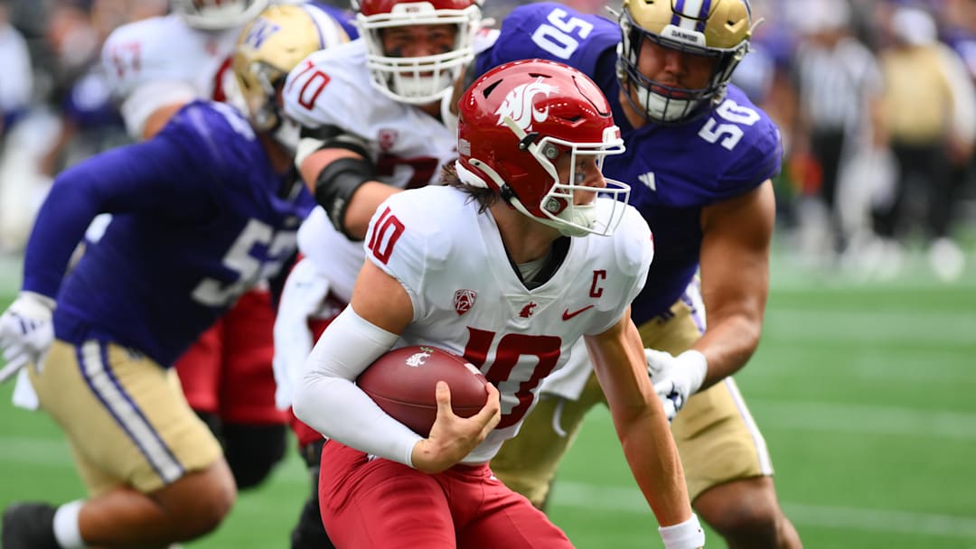 Sep 14, 2024; Seattle, Washington, USA; Washington State Cougars quarterback John Mateer (10) carries the ball against the Washington Huskies during the first half at Lumen Field. Mandatory Credit: Steven Bisig-Imagn Images