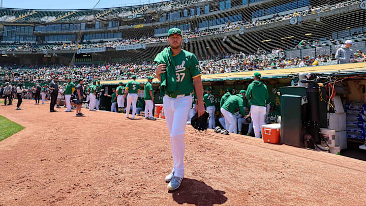 May 26, 2024; Oakland, California, USA; Oakland Athletics pitcher Jack O'Loughlin (37) walks to the bullpen before the start of the game against the Houston Astros at Oakland-Alameda County Coliseum. Mandatory Credit: Robert Edwards-Imagn Images