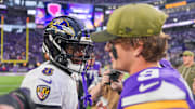 Nov 9, 2025; Minneapolis, Minnesota, USA; Baltimore Ravens quarterback Lamar Jackson (8) and Minnesota Vikings quarterback J.J. McCarthy (9) after the game at U.S. Bank Stadium. Mandatory Credit: Brad Rempel-Imagn Images
