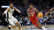 Mar 23, 2025; Cleveland, OH, USA; New Mexico Lobos guard Donovan Dent (2) dribbles in the second half against the Michigan State Spartans during the NCAA Tournament Second Round at Rocket Arena. Mandatory Credit: Rick Osentoski-Imagn Images