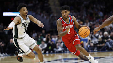 Mar 23, 2025; Cleveland, OH, USA; New Mexico Lobos guard Donovan Dent (2) dribbles in the second half against the Michigan State Spartans during the NCAA Tournament Second Round at Rocket Arena. Mandatory Credit: Rick Osentoski-Imagn Images