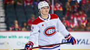 Caufield skates across the ice during a game against the Calgary Flames at Scotiabank Saddledome.