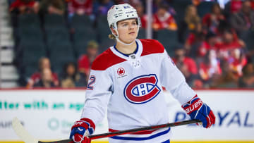 Caufield skates across the ice during a game against the Calgary Flames at Scotiabank Saddledome.