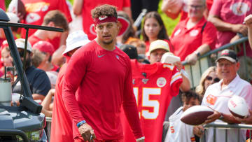 Jul 22, 2024; St. Joseph, MO, USA; Kansas City Chiefs quarterback Patrick Mahomes (15) signs autographs for fans after training camp at Missouri Western State University. Mandatory Credit: Denny Medley-USA TODAY Sports