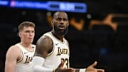 Oct 26, 2024; Los Angeles, California, USA; Los Angeles Lakers forward LeBron James (23) and guard Dalton Knecht (4) reacts to a ref’s call against the Sacramento Kings during the first half at Crypto.com Arena. Mandatory Credit: Jonathan Hui-Imagn Images