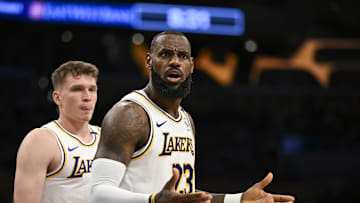 Oct 26, 2024; Los Angeles, California, USA; Los Angeles Lakers forward LeBron James (23) and guard Dalton Knecht (4) reacts to a ref’s call against the Sacramento Kings during the first half at Crypto.com Arena. Mandatory Credit: Jonathan Hui-Imagn Images
