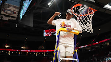 South Carolina basketball forward Sania Feagin cutting down the nets following the 2023-2024 National Championship