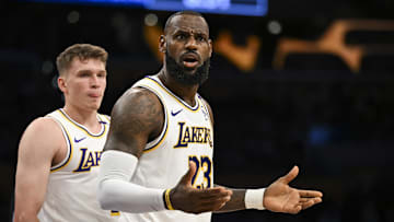 Oct 26, 2024; Los Angeles, California, USA; Los Angeles Lakers forward LeBron James (23) and guard Dalton Knecht (4) reacts to a ref’s call against the Sacramento Kings during the first half at Crypto.com Arena. Mandatory Credit: Jonathan Hui-Imagn Images